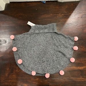 CARTWHEELS - little girls size 4T-5T grey & white knit cape with pink Pom Poms